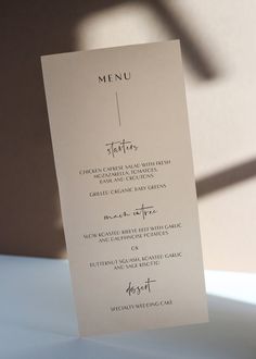 the menu card is sitting on top of a table