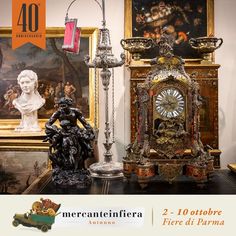 there are two antique clocks on display in this room with paintings and sculptures behind them