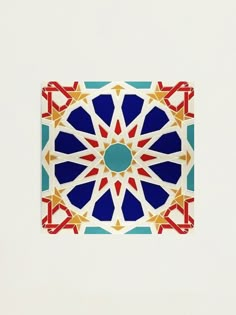 an artistic tile design in blue, red and yellow