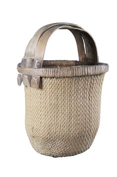 an old woven basket with metal handles