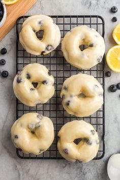 lemon blueberry donuts on a cooling rack