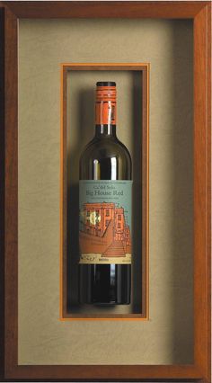 a bottle of wine in a wooden frame with a brown border on the bottom half