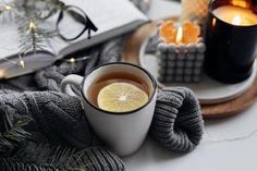 a cup of tea with lemon on the table