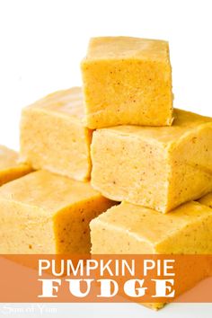 several squares of yellow cake sitting on top of each other in front of a white background