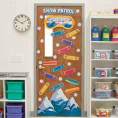 a door with snow patrol on it in a playroom filled with toys and other items