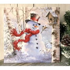 a painting of a snowman with a red scarf and top hat, standing next to pine cones