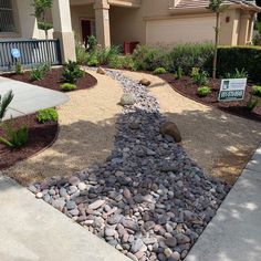 a gravel path in front of a house