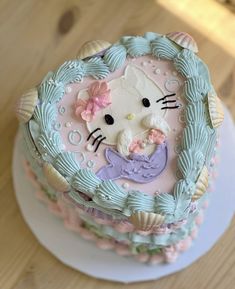 a hello kitty cake on a white plate