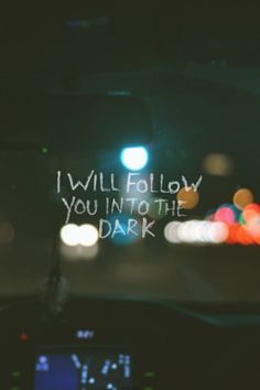 a car dashboard with the words i will follow you into the dark written on it