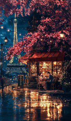 two people sitting at a table in front of the eiffel tower, paris