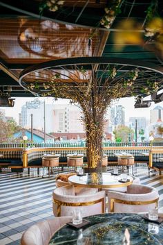 an outdoor dining area with tables and chairs