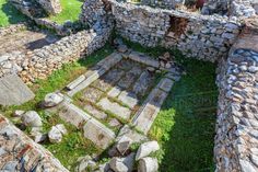 an aerial view of the ruins at pompeii, with grass and rocks