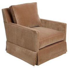 a brown chair with two pillows on it