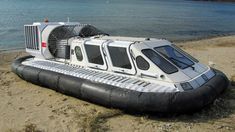 an inflatable boat sitting on the beach