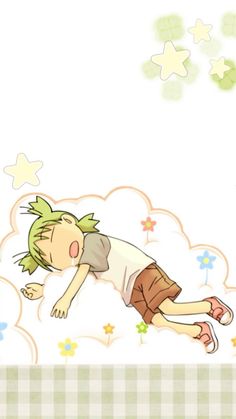 a young boy laying on top of a cloud