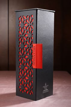 a black and red box with a red label on it