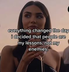 a woman holding a wine glass with the caption everything changed the day i decided that people are my lessons, not my enemies