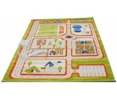 a child's play rug with an orange and green design on the top of it