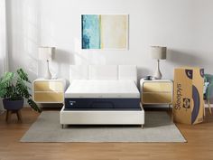 an image of a bedroom setting with mattresses and boxes on the floor in front of it