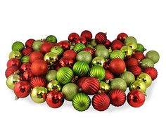 a pile of red and green christmas ornaments