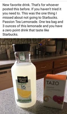 a bottle of tazo next to a carton of lemonade on a counter