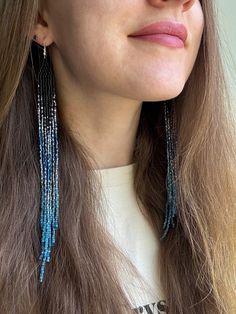 These very long black earrings made of sparkling beads with a blue gradient represent an elegant combination of style and sophistication. The black color gives the accessory a sense of severity, while the blue sparkling gradient adds brightness and striking contrast. Wear these earrings to create a refined and stylish look that will attract admiring glances. Made from Czech beads. Hypoallergenic clasp. Length 8 inches (20cm). Width 0.5 inches (1.5cm). If you want these earrings in a different co Fringe Bead Earrings, Extra Long Earrings, Blue Beaded Earrings, Ombre Earrings, White Ombre, Blue Gradient, Beaded Fringe, Earrings Black, Earrings Long