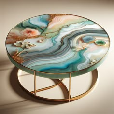 The AI-generated table showcases botanical-themed resin art in calming hues with a touch of gold leaf luxury. Its soft aesthetic and sophistication mirrors comfort, elegance, and artistic expression of middle-aged women. 

#ResinArtTable #BotanicalResinArt #MiddleAgedAesthetic #GoldLeafAccents #SophisticatedFurniture #AIgeneratedDesign Diy Resin Table, Rocks Crafts, Geode Wall, Sophisticated Furniture, Resin Table Top, Resin Geode, Craft Resin