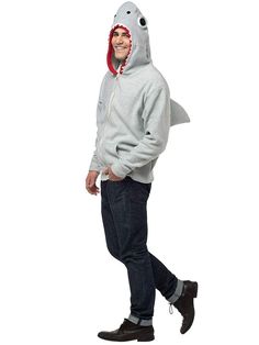 a man wearing a shark hoodie and jeans