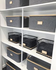 the shelves are filled with baskets and bins for storing clothes, books or other items