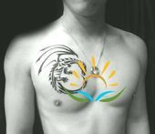 a shirtless man with an abstract sun tattoo on his chest and chest is standing in front of a black background