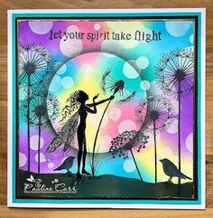 a card with a silhouette of a girl holding dandelions in front of the words let your spirit take flight