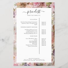 the floral bridal list is displayed on a marble table with pink roses and greenery