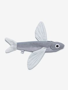 a stuffed fish is shown on a white background