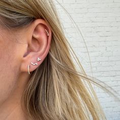 An everyday earring that can be layered on the ear or worn by itself! 14k White Gold Single Ear Cuff, Dainty 14k Gold Ear Cuff For Everyday, 14k White Gold Ear Climbers, 14k Gold Ear Climbers With Ear Wire, Elegant 14k Gold Ear Cuff With Ear Wire, Elegant Tiny 14k Gold Huggie Earrings, Single 14k White Gold Ear Cuff, Elegant Everyday Sterling Silver Piercings, Everyday Elegant Sterling Silver Piercings