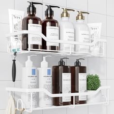 three shelves holding different types of soaps and lotions on the side of a white tiled wall