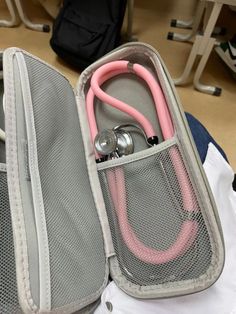 an open suitcase with a stethoscope in it