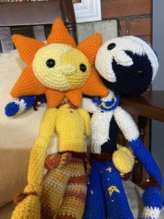 three crocheted stuffed animals sitting next to each other