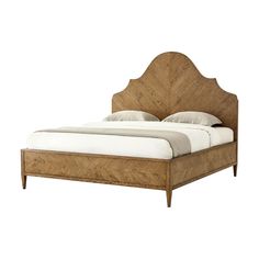 a bed that is made up with wood and white linens on the headboard