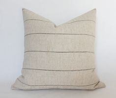 a white pillow with black lines on it