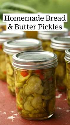 several jars filled with pickled vegetables sitting on top of a red tablecloth covered surface