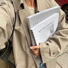 a woman holding a book in her hands