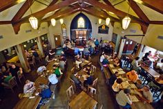 an overhead view of a restaurant with people sitting at tables and eating in the dining area