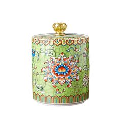 a green canister with colorful designs on it