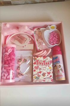 a pink box filled with lots of different items