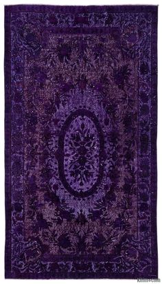 a purple rug with an intricate design on it