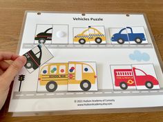 a person is holding up a vehicle puzzle