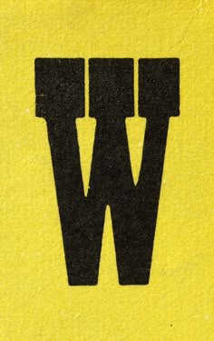 the letter w is written in black on a yellow background