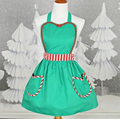 a green apron with candy canes on it