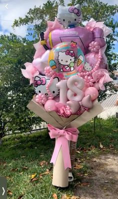 hello kitty balloon bouquet with balloons in the shape of animals and numbers for an anniversary gift