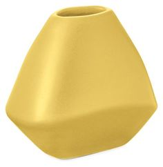 a yellow vase sitting on top of a white table